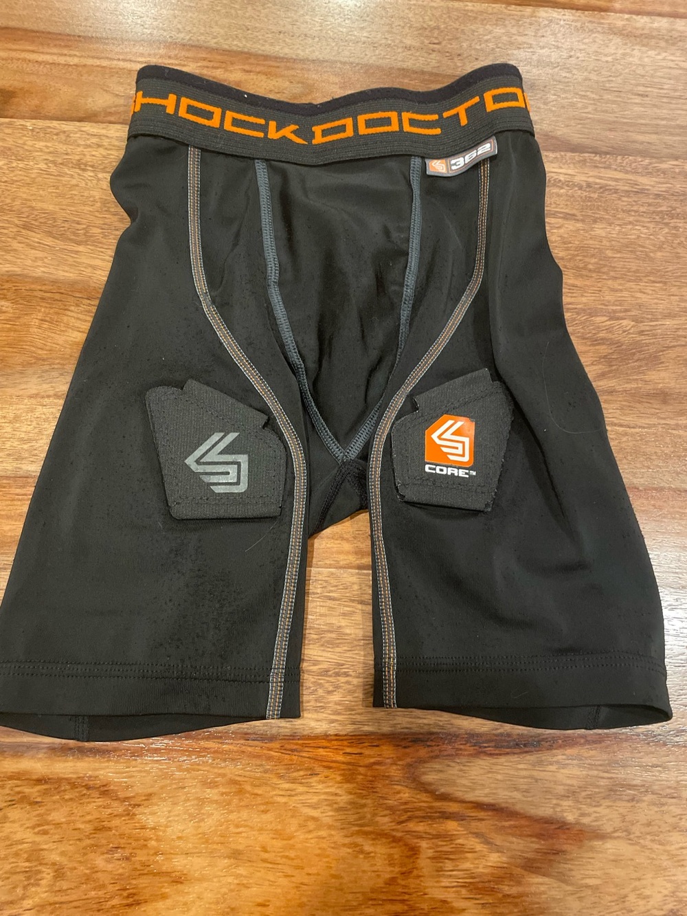 Shock Doctor Kid’s Black Compression Shorts with Orange Waistband